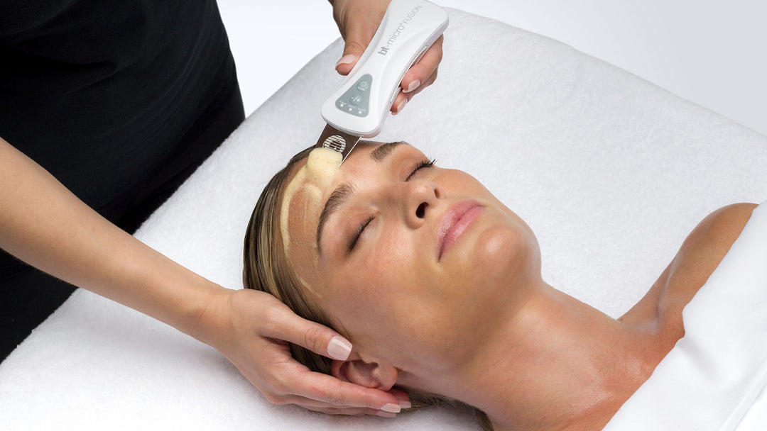 Woman receiving a facial treatment with a Bio-Therapeutic device and Aqua Foam Peel product on her face.
