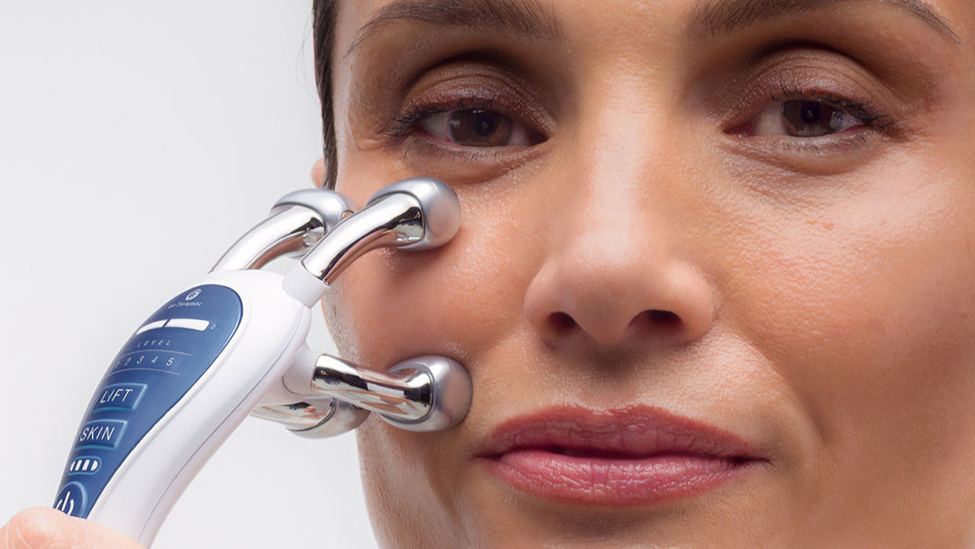 Woman using a facial device on her face with a close-up view.